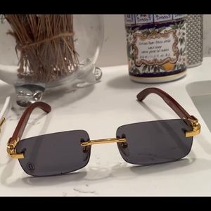 Black tint Cartier with gold